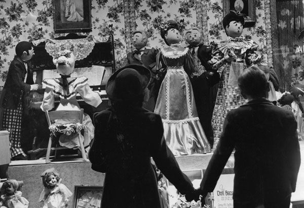 Window-shoppers at a Christmas window in St. Louis in 1939.